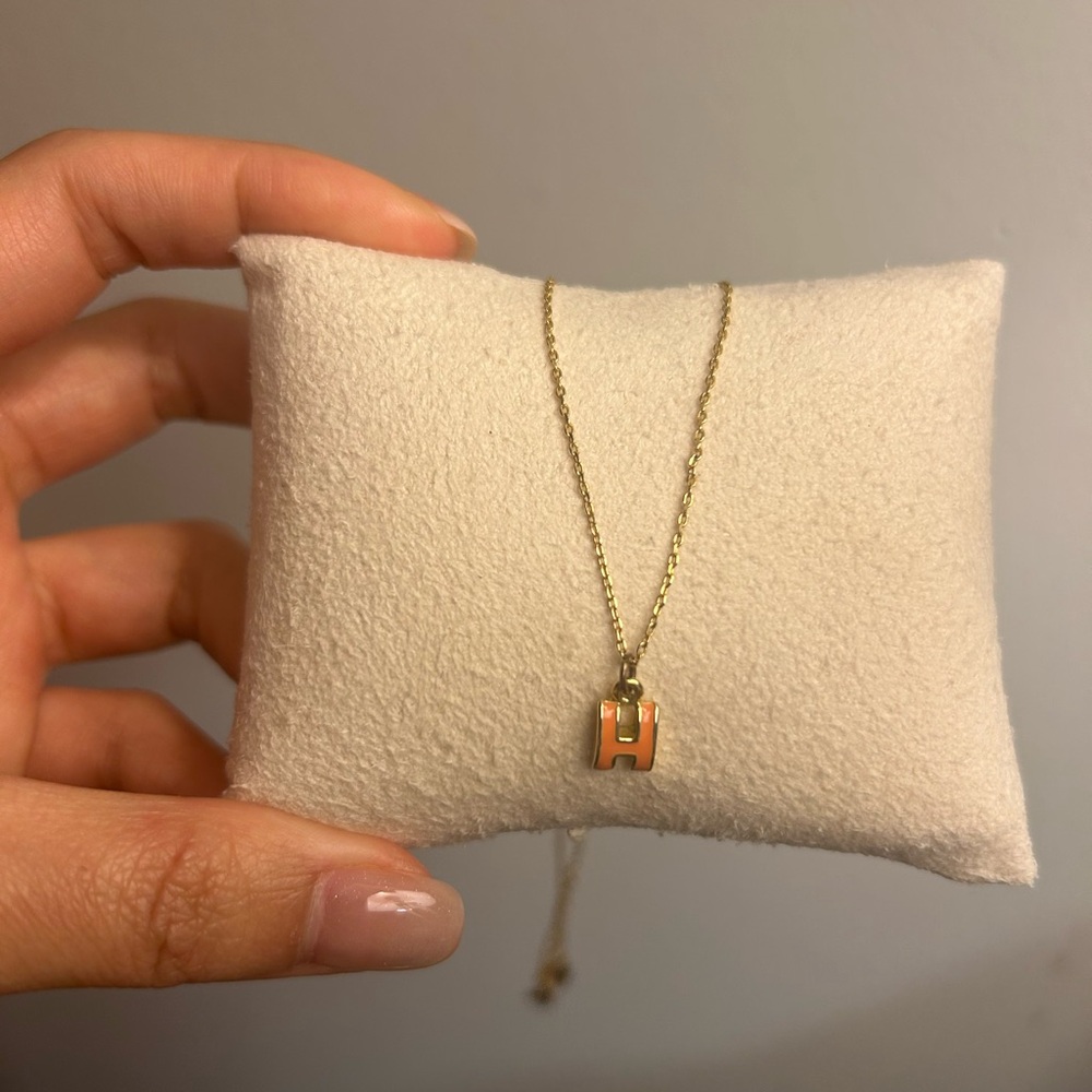 Letter H necklace in orange and gold chain